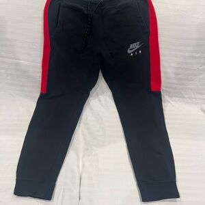 Nike Kids Black Joggers with Red Stripes